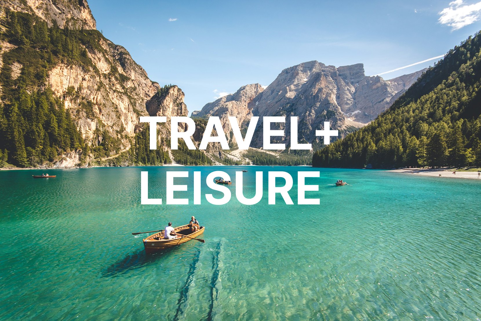 Travel + Leisure: a rowboat on a turquoise alpine lake surrounded by mountains